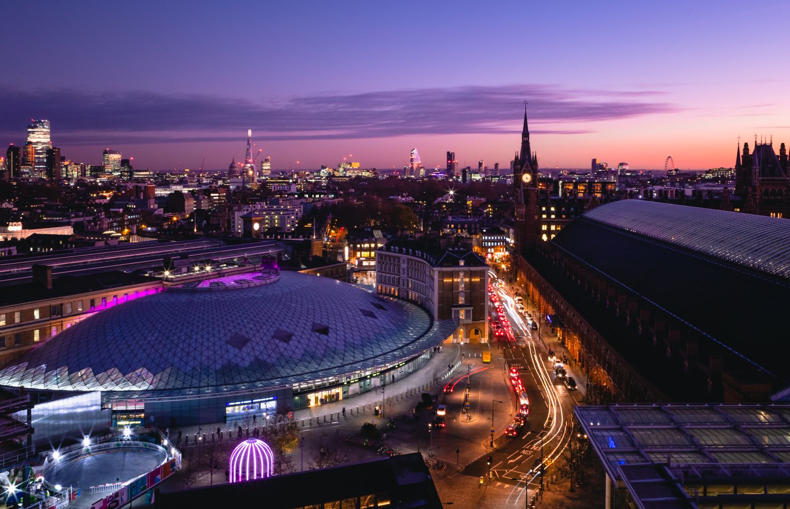 King’s Cross and St Pancras at dusk, with the City skyline behind